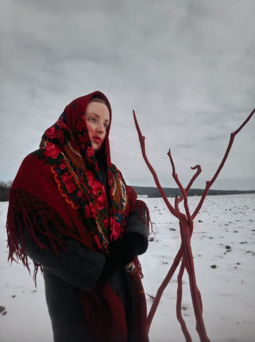 Woman Wearing a Headscarf and a Winter Coat 