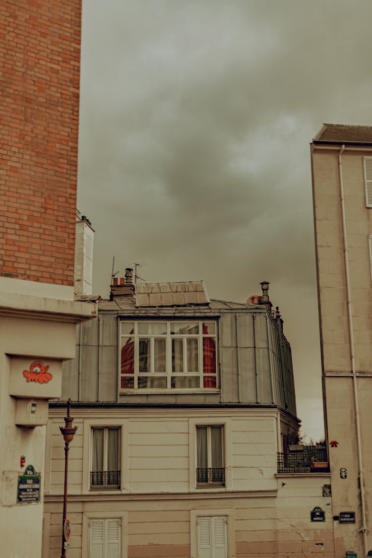 House With A Mansard Under Gray Clouds, Montmartre, Paris