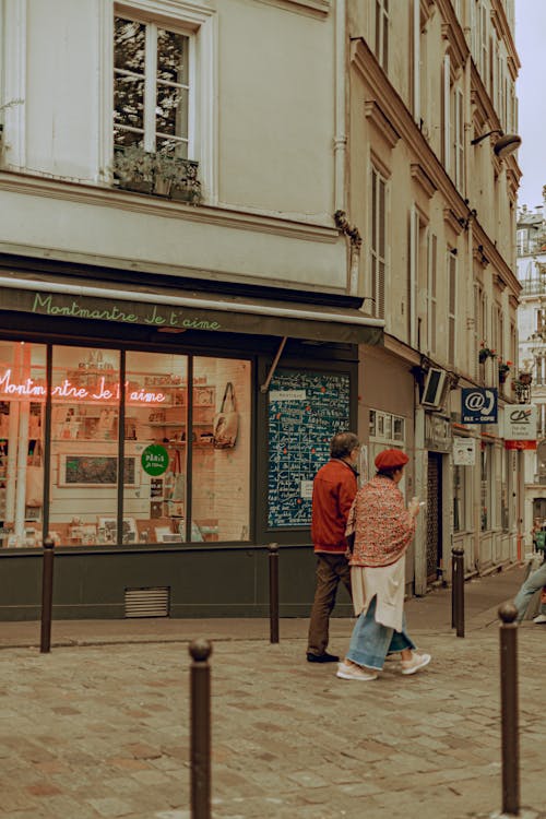 People Walking By Store Display