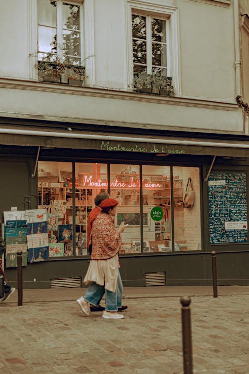 People Walking By Store Display