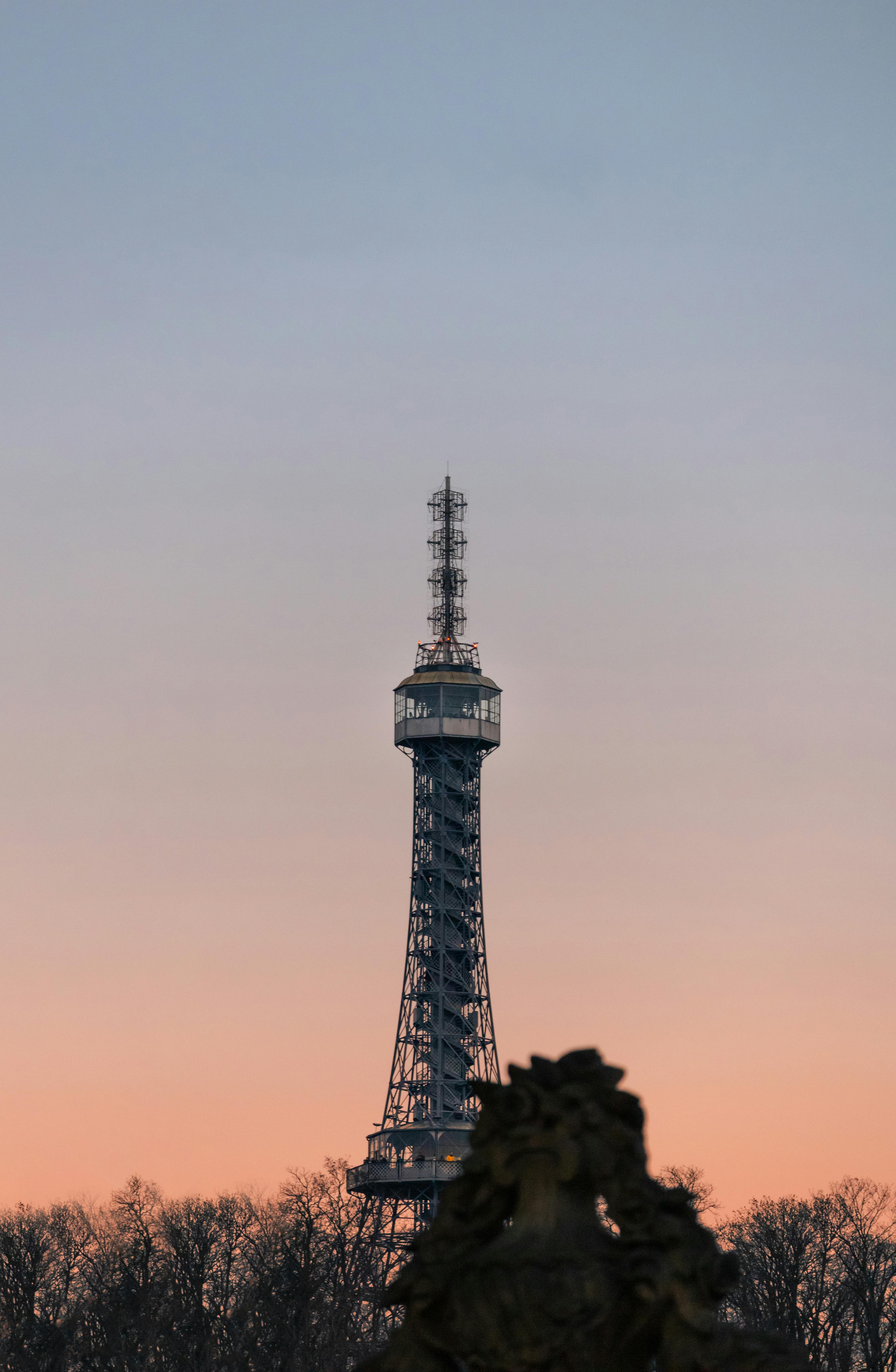 the eiffel tower is seen at sunset in paris