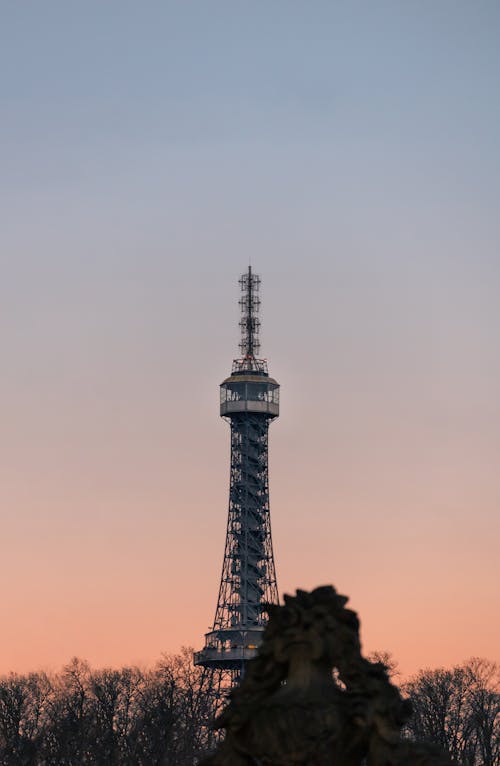 The eiffel tower is seen at sunset in paris