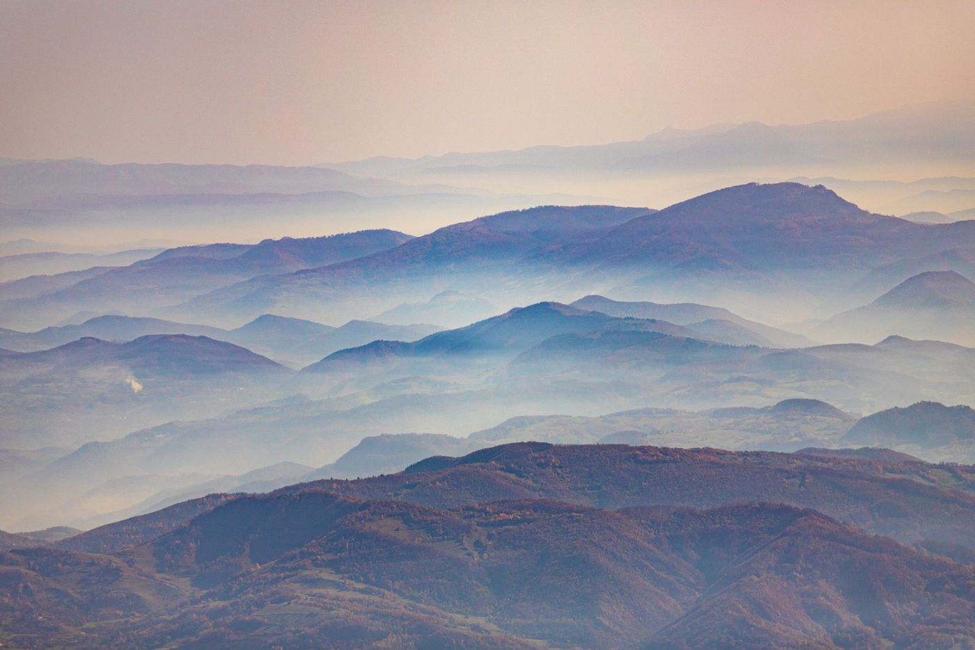 Misty mountain ranges at sunset by Amel Uzunovic on Pexels