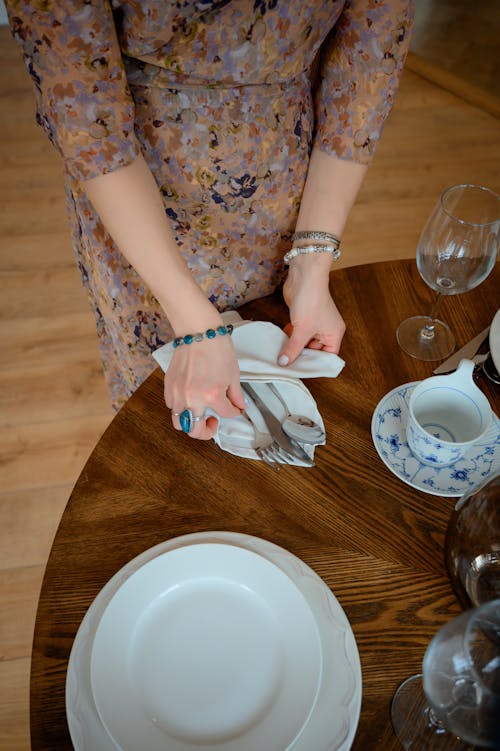 A Woman Setting the Table 