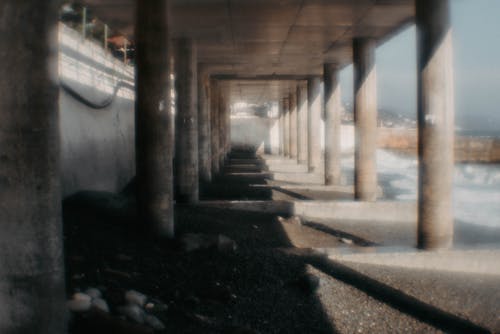 Blurred Photo of a Concrete Passage Over the Sea