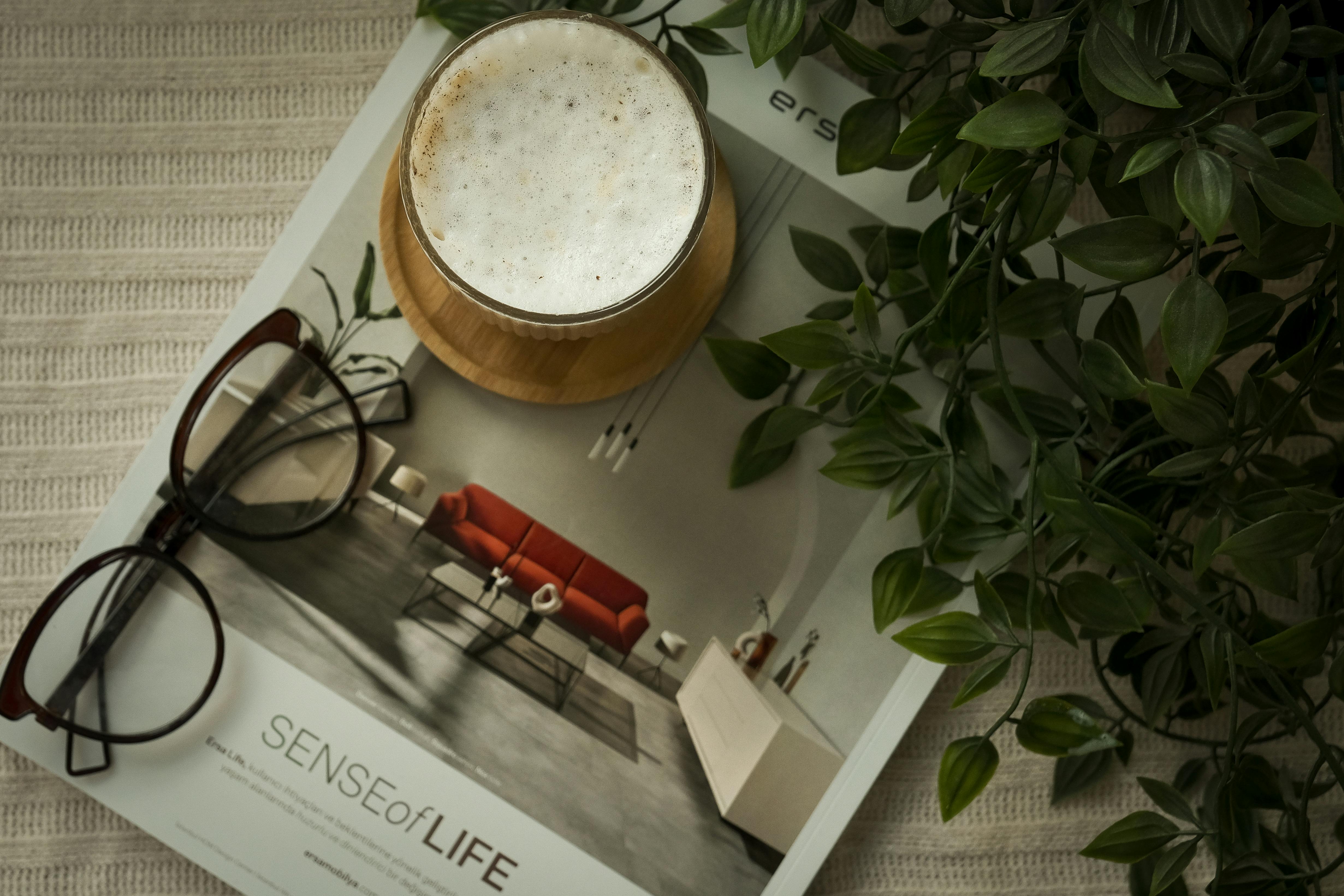 A Magazine, Glasses and a Cup of Coffee
