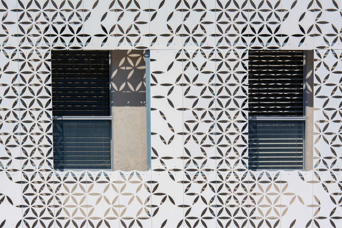 A window with geometric patterns on it · Free Stock Photo