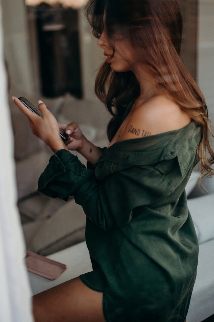 Young Brunette In A Dark Green Shirt 