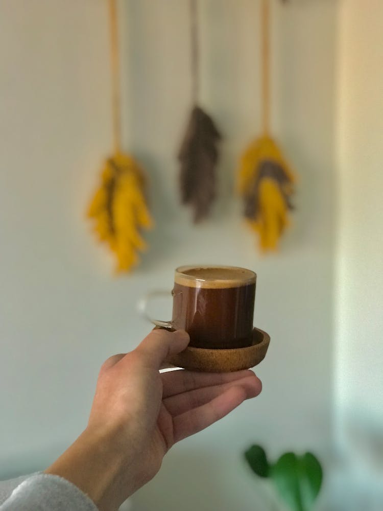 Coffee In Glass In Hand