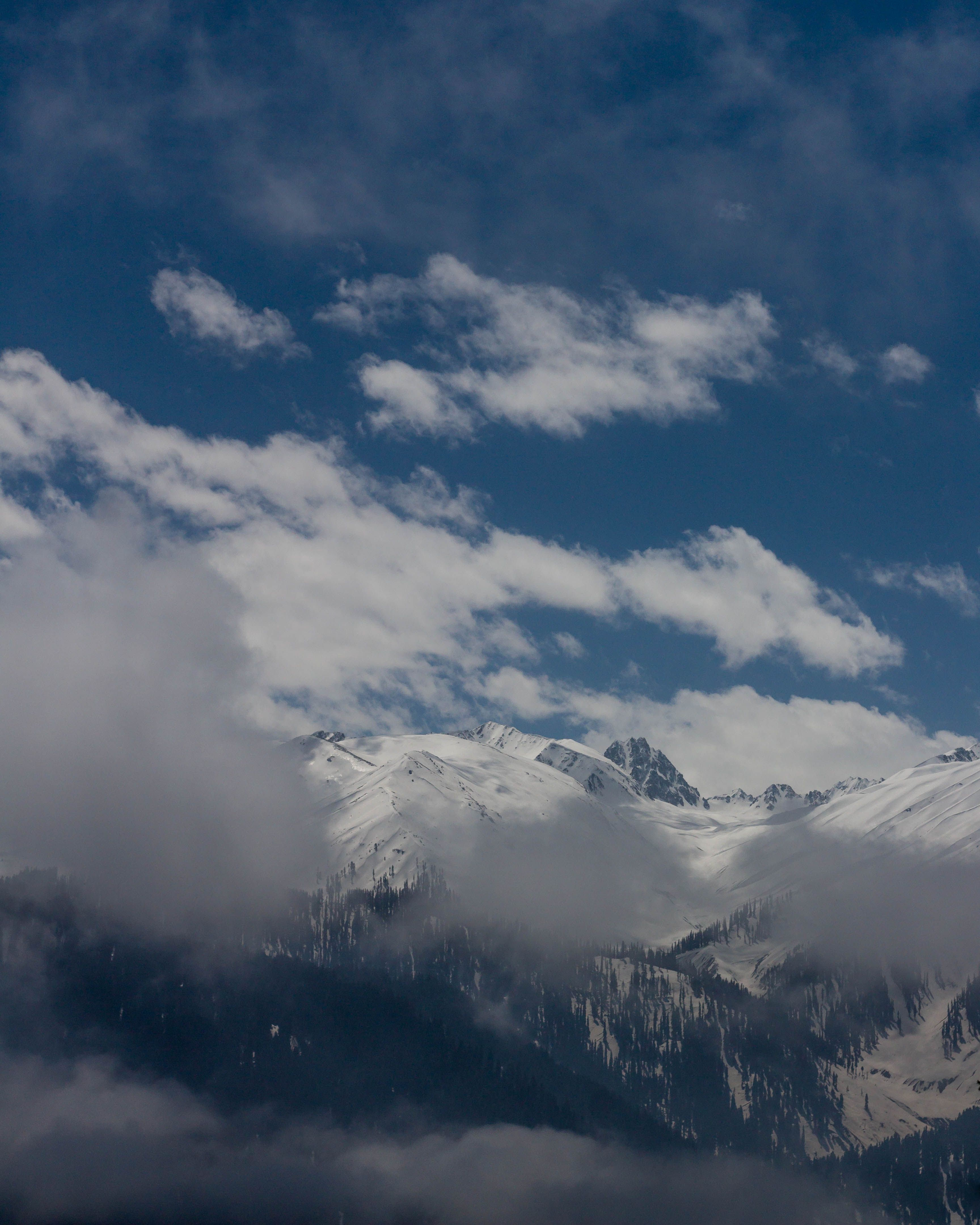 Clouds over Snowy Mountain · Free Stock Photo