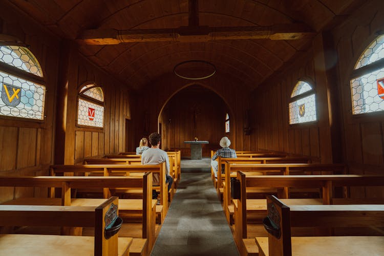 People In Wooden Church