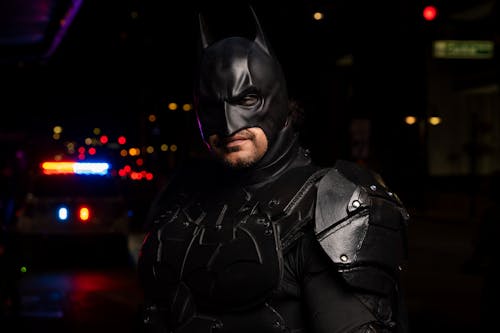 Man in Batman Costume at Night