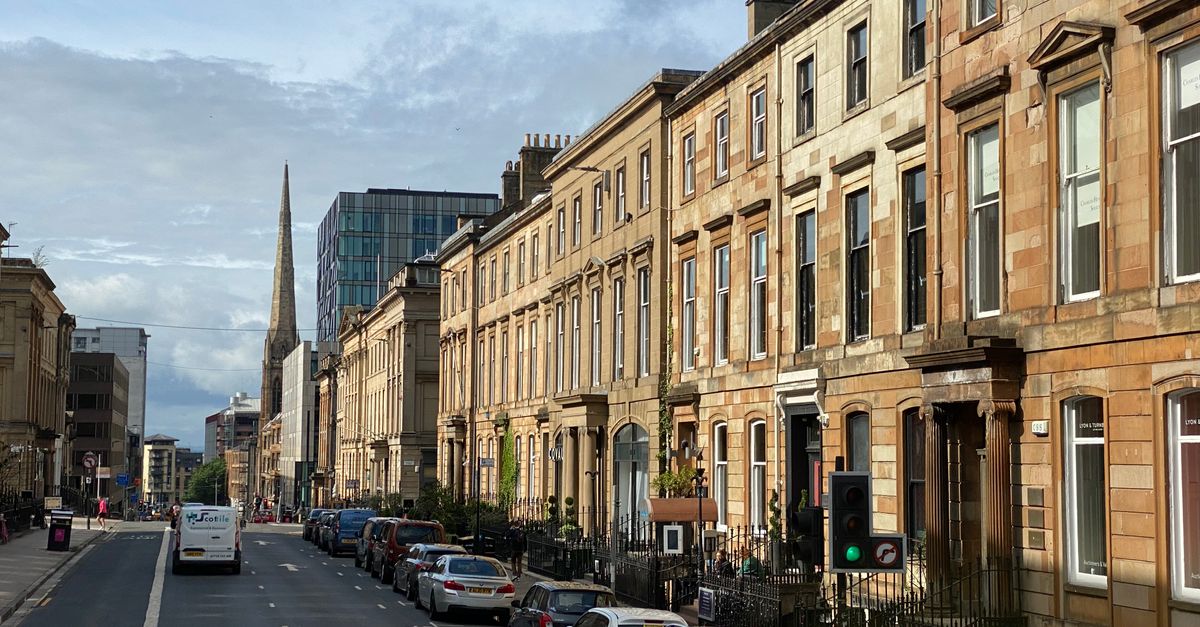 View of a historic residential street in Glasgow, capturing classic and modern architecture.
