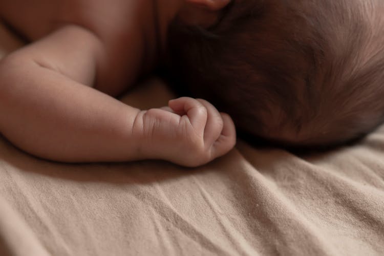 Close-up Of A Newborn Baby Arm 