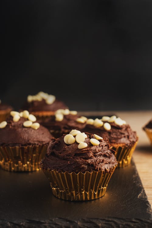 Chocolate Cup Cakes with White Decoration on the Top