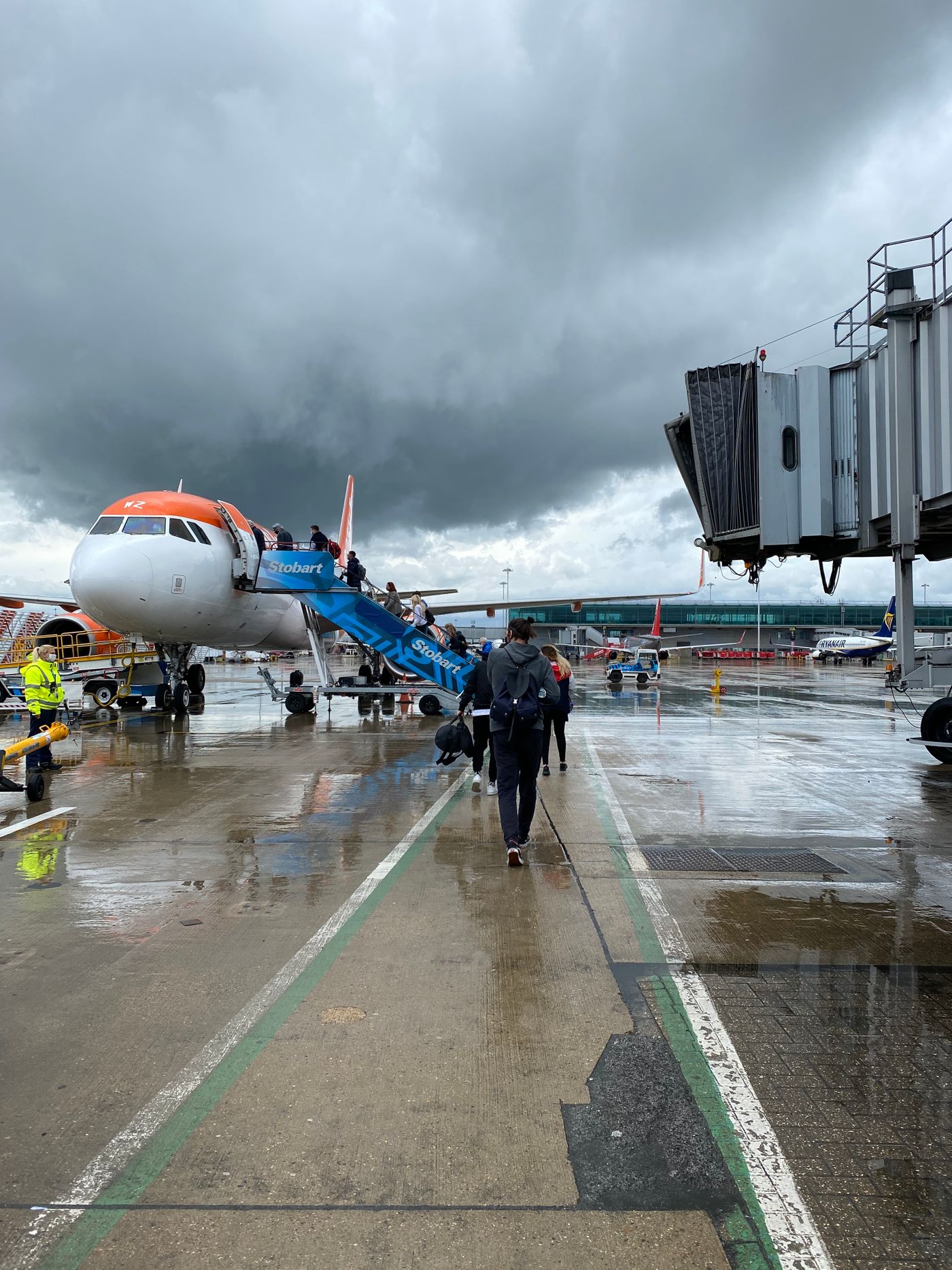 Travelers walking toward an aircraft before a flight