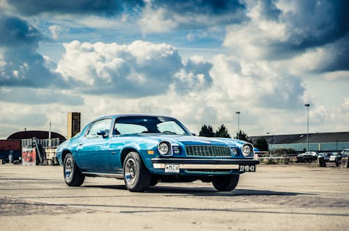 Blue Classic Car on Parking Lot