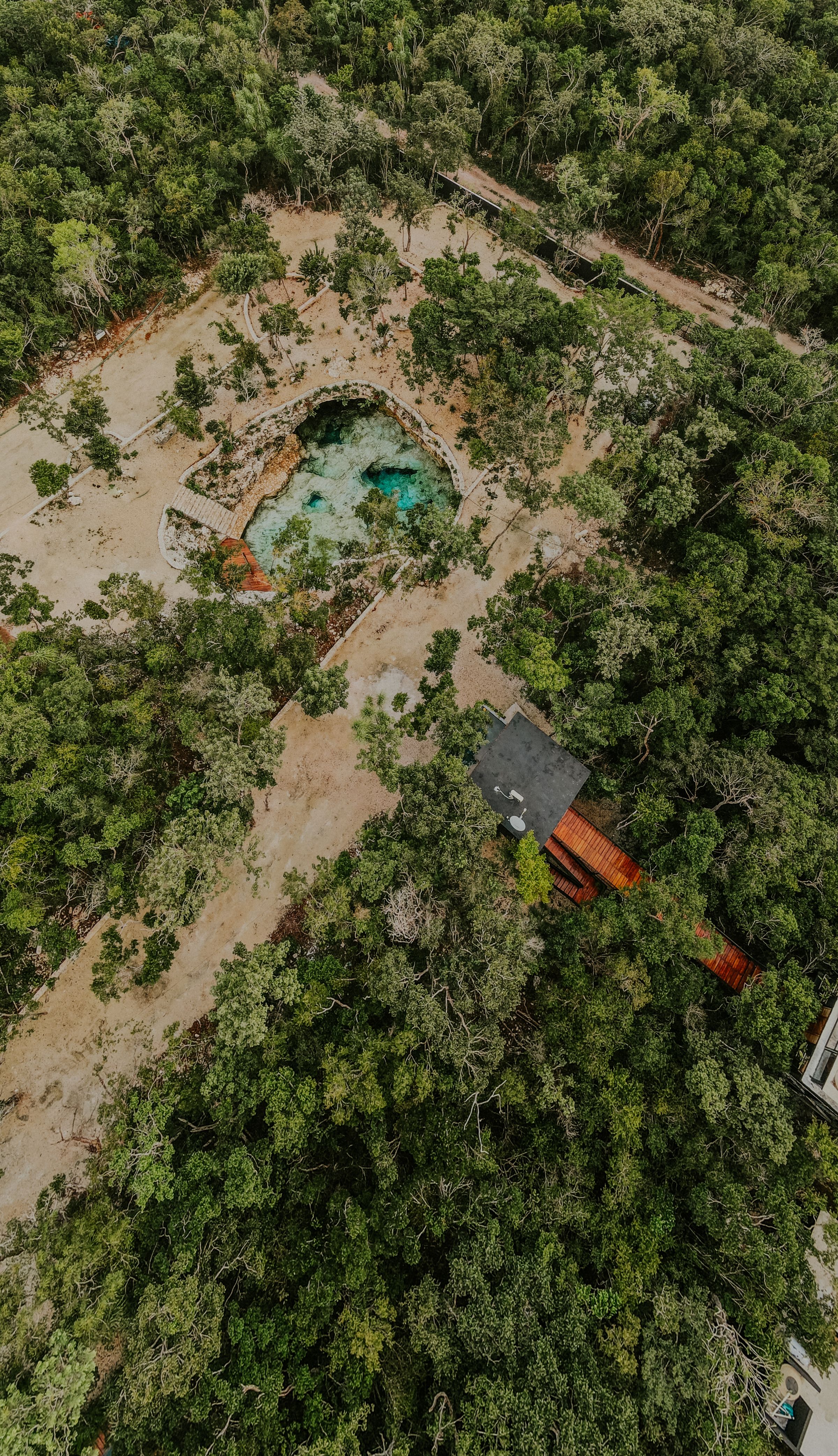 Aerial view of the Yucatán jungle and a cenote, the region where Maya villages still live in Mexico
