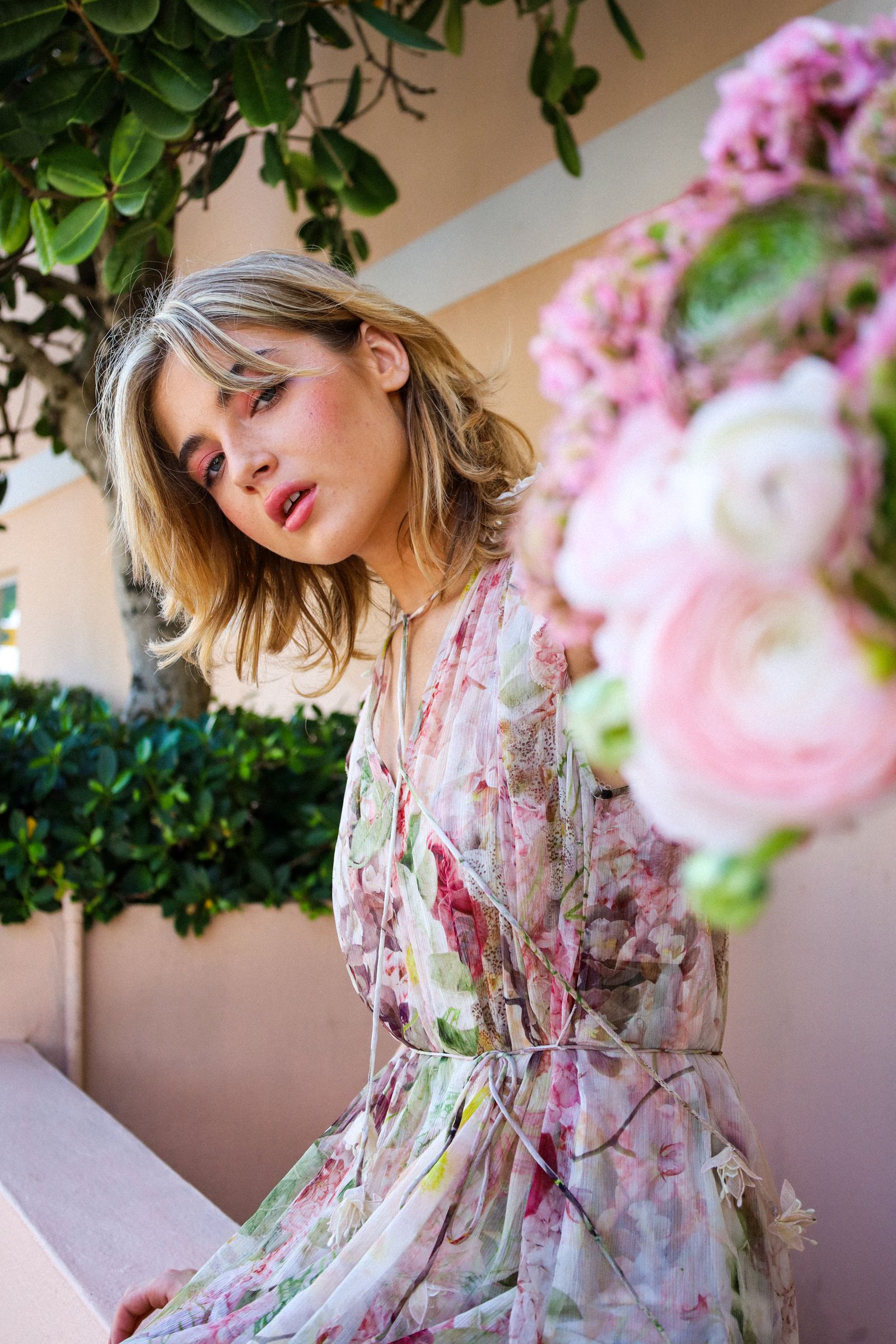 The Garden Party Edit — a model in a summer floral dress styled for a garden party