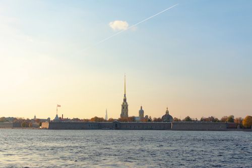 Free A captivating view of Saint Petersburg skyline featuring a historic fortress at sunset. Stock Photo