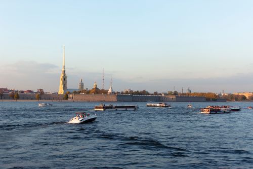 Free Scenic view of Saint Petersburg's waterfront featuring motorboats on a calm autumn day. Stock Photo