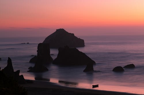 Rocks in Ocean by Shore