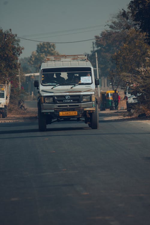 Truck Driving on Road in Countryside