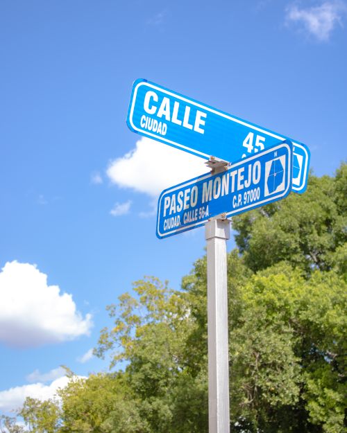 Free Street sign intersection at Calle 45 and Paseo Montejo in Mérida, México, sunny day. Stock Photo