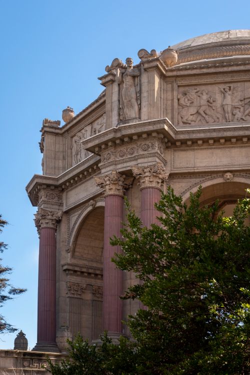 Free The ornate columns and sculptures of San Francisco's iconic Palace of Fine Arts under a clear blue sky. Stock Photo
