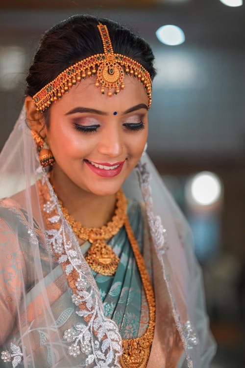 Smiling Woman in Traditional Clothing and Jewelry