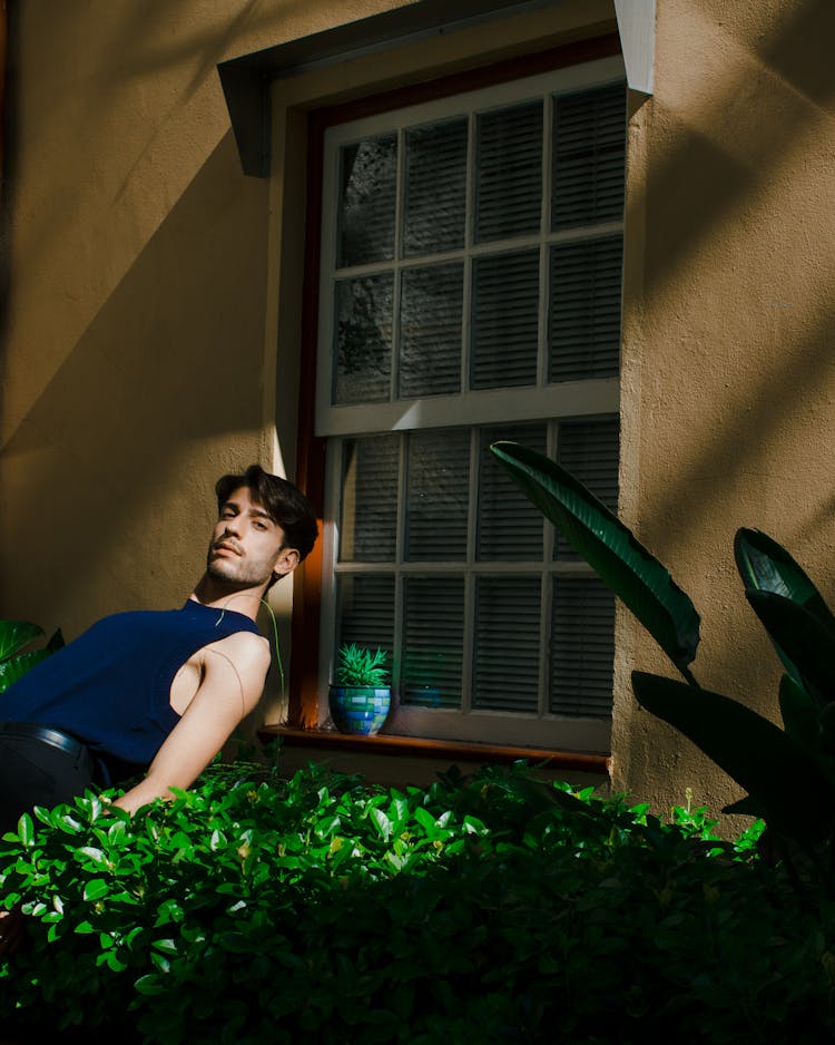 Man Relaxing By House