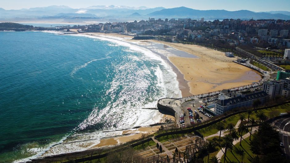 Ultimate Supercar & Helicopter Experience in Barcelona Review 2026 - Stunning aerial shot of Santander's coastline with a vibrant cityscape and sandy beach in Spain.