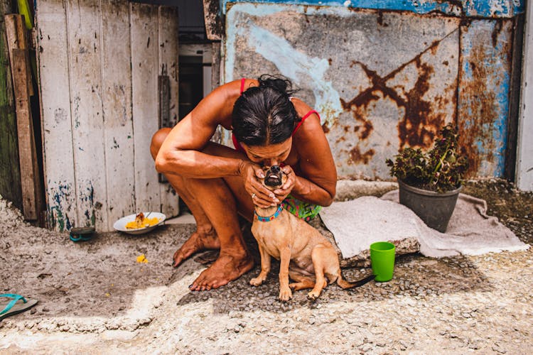 Woman Kissing Her Dog 