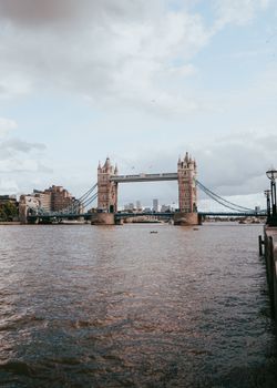 Stunning view of Tower Bridge spanning the River Thames in London, showcasing its Victorian Gothic architecture.