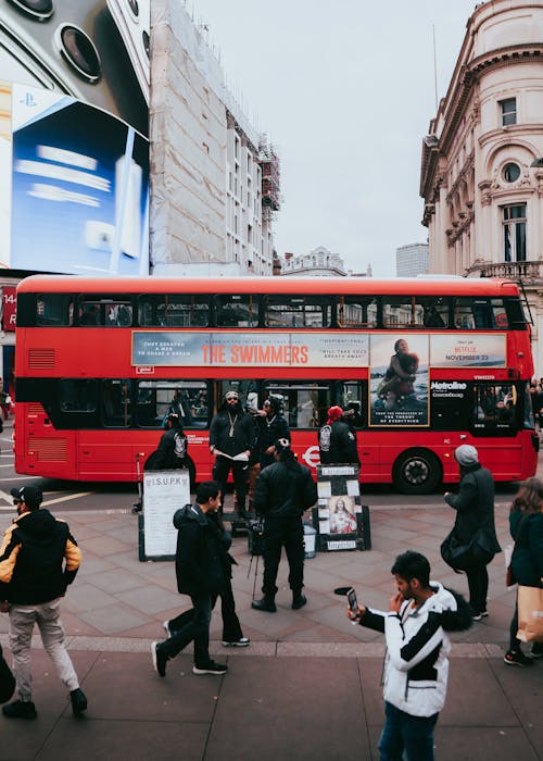 View of a Double-decker Bus and Pedestrians on the Streets on London, England, UK