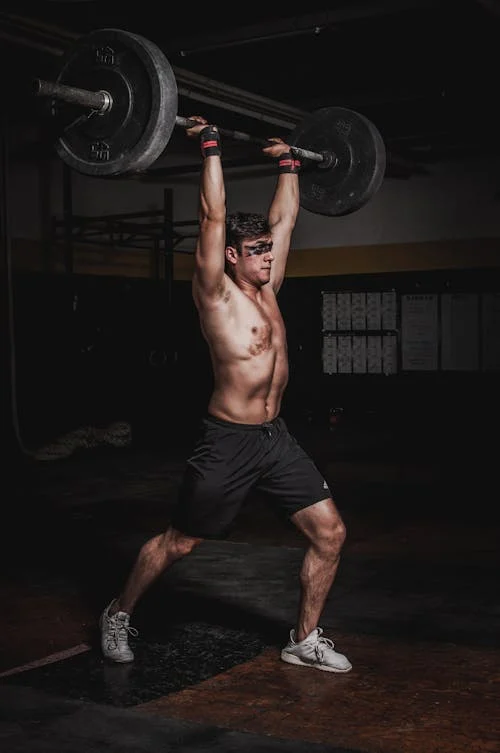 Free Man Lifting A Barbell Stock Photo