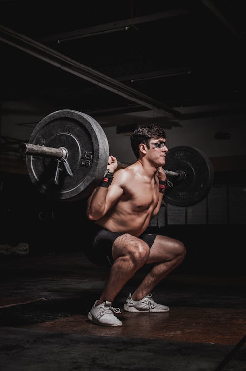 Foto Man Lifting Barbell