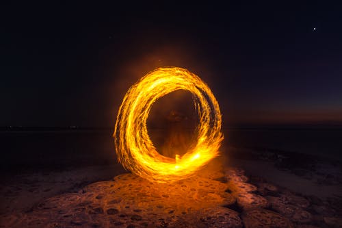 Free Person Performing Fire Dance at Night Stock Photo