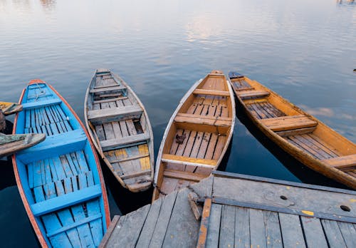 Colorful Boats Moored at a Wooden Dock Pier 