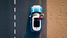 Aerial Photography of Blue Car on Road