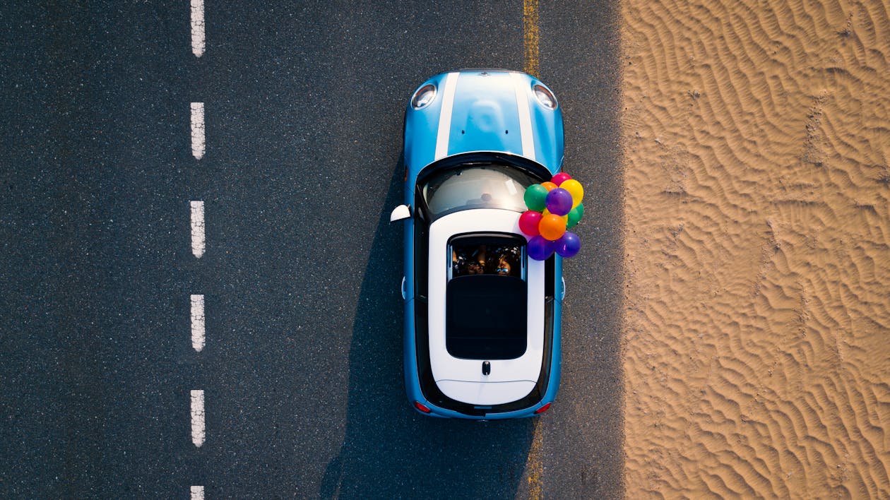 Balloons attached to a blue car