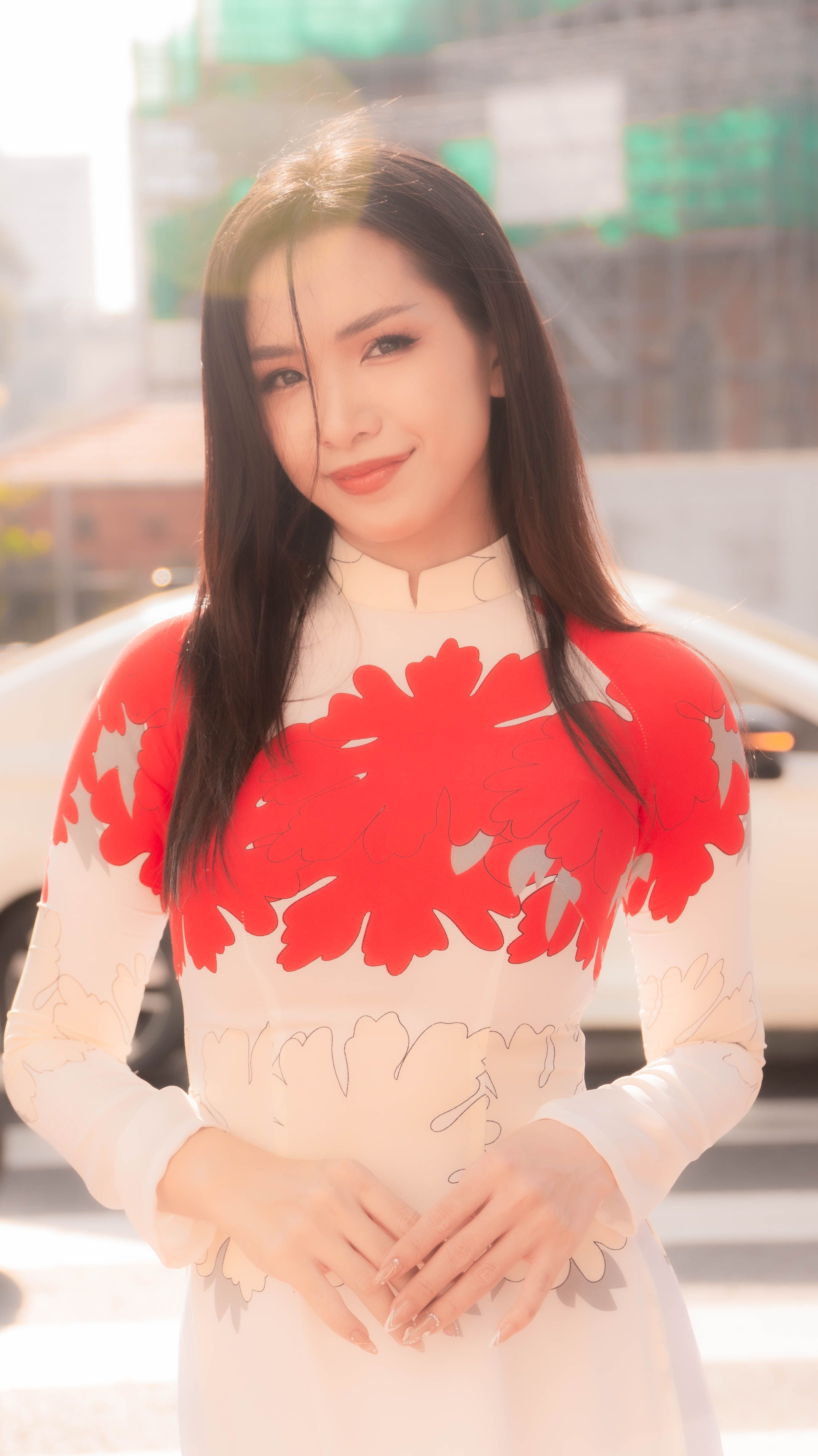 Smiling Young Woman Posing Outdoors · Free Stock Photo