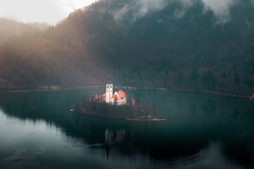 Free Captivating aerial view of the iconic Church on Bled Island, surrounded by serene Lake Bled. Stock Photo