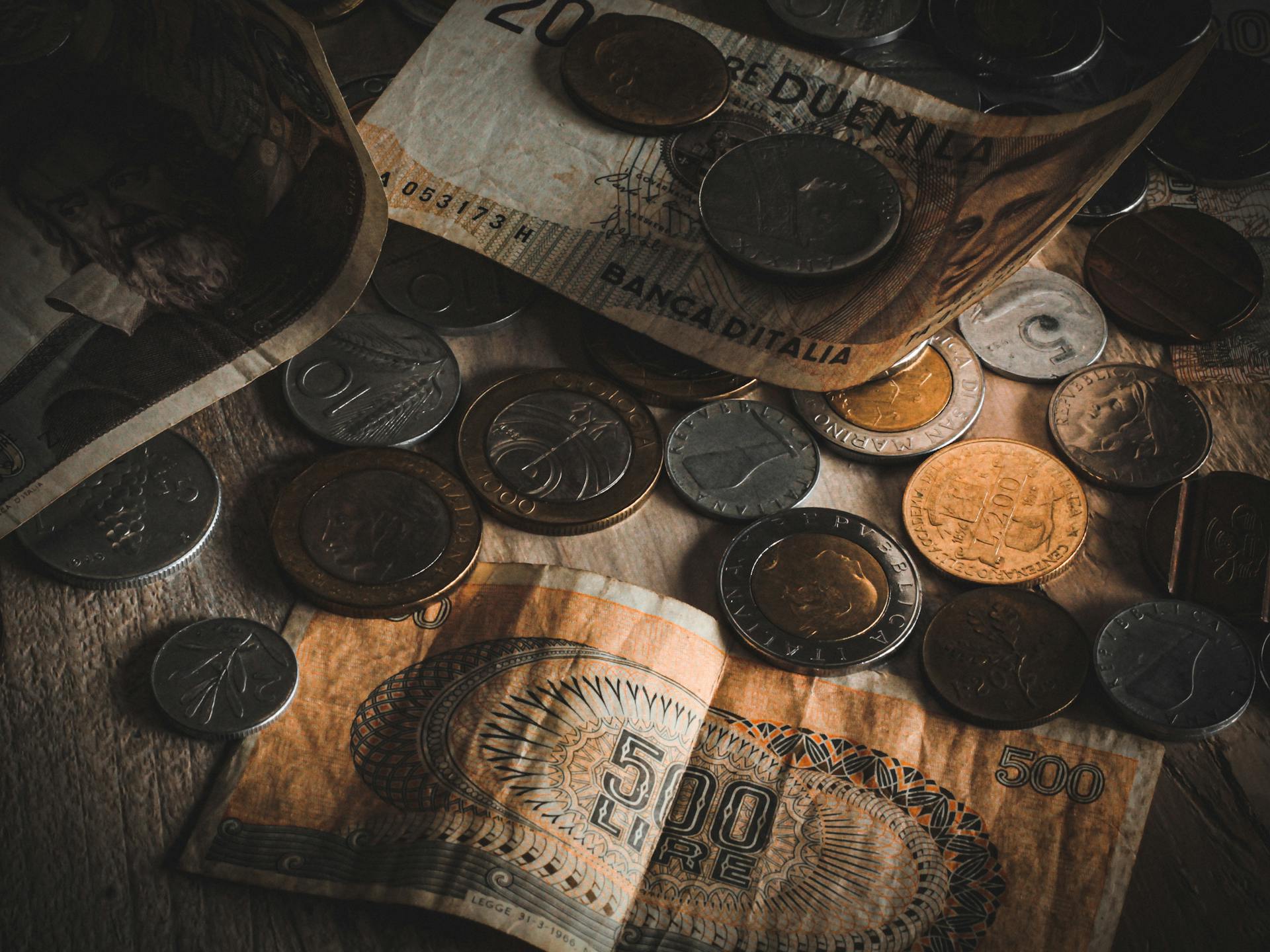 Banknotes and Coins on Table