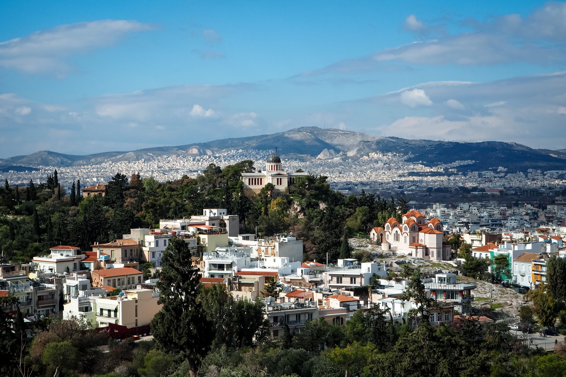Explore a stunning aerial view of Athens, featuring vibrant landscapes and iconic architecture.