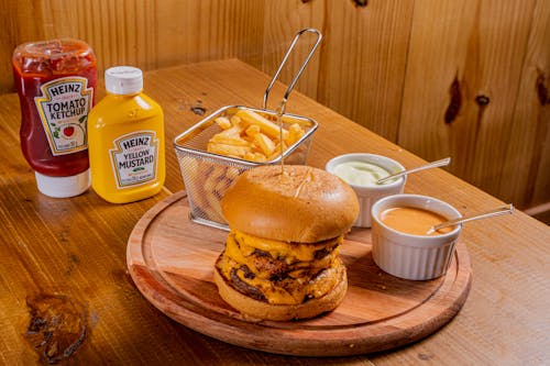 Cheeseburger and Chips on a Wooden Tray 