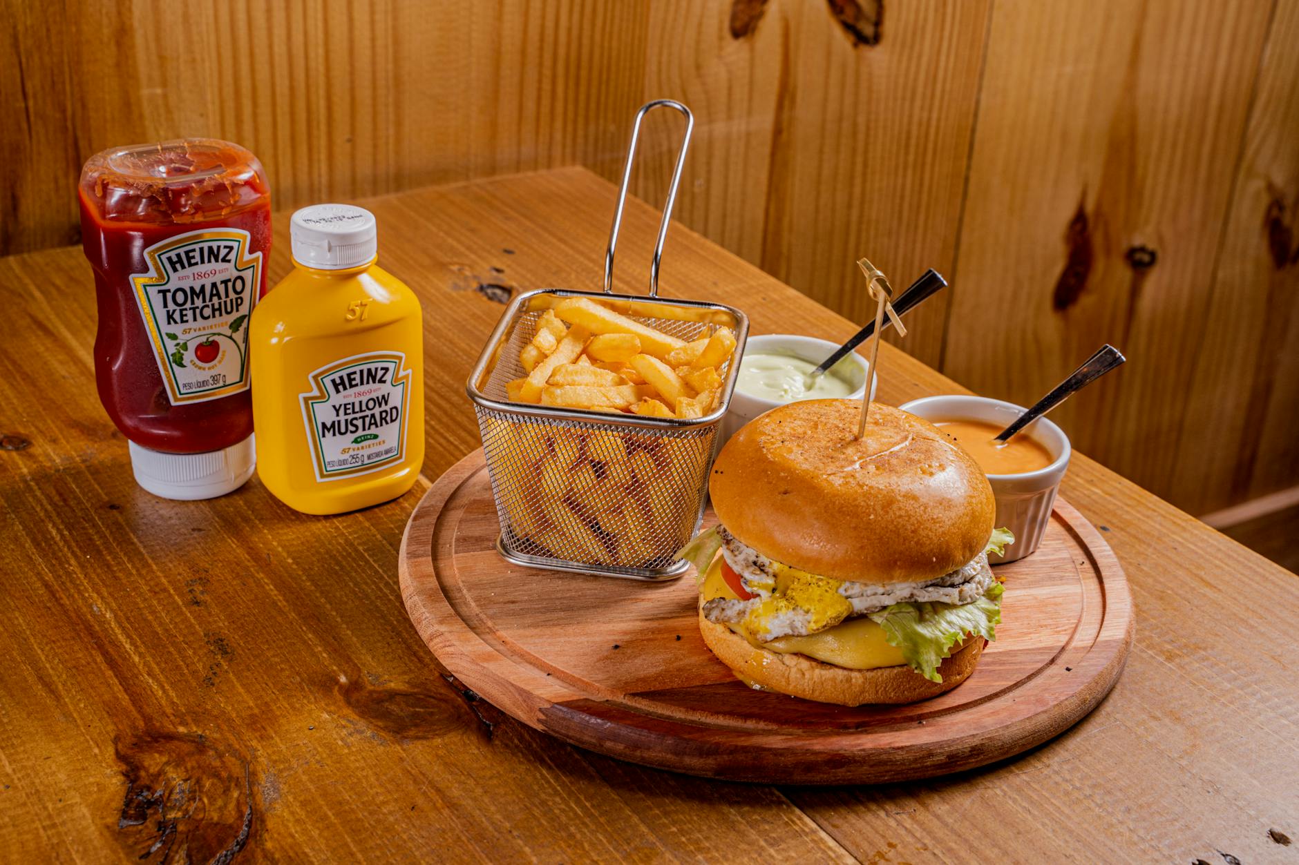 Ketchup On A Plate With A Burger And Fries, Showing The Sticky Consistency And Bright Red Color