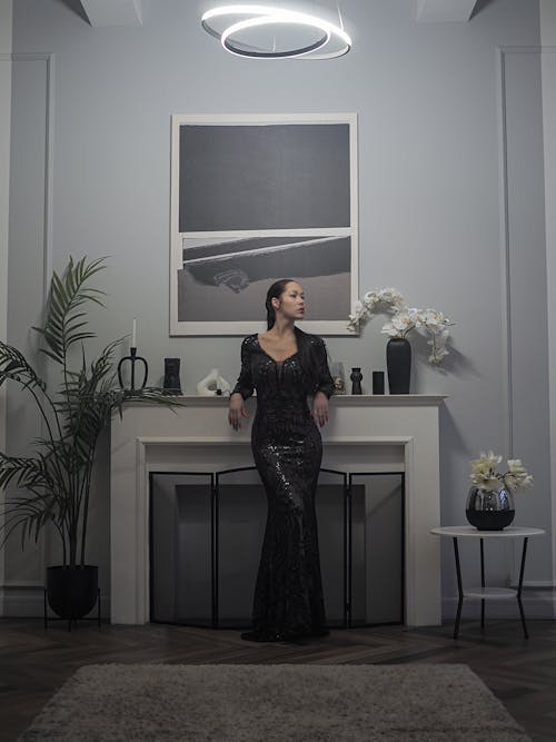 Standing Woman Leaning on Fireplace