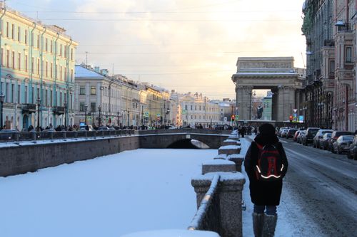 Free Snow-covered canal in St. Petersburg bordered by historical architecture on a crisp winter day. Stock Photo