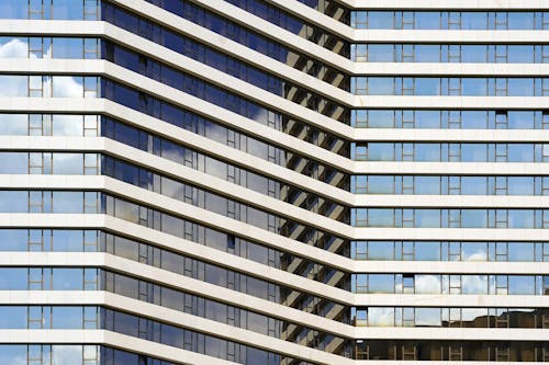 Glass windows of facade modern city business building skyscraper